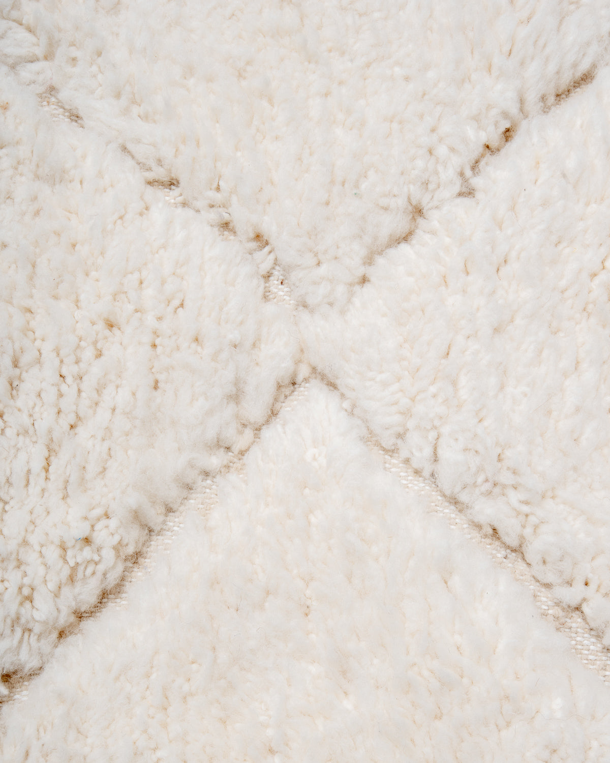 Modern, designer, handcrafted Berber rug from Morocco. Beniourain carpet with minimalist design, natural wool pile and a fluffy texture.